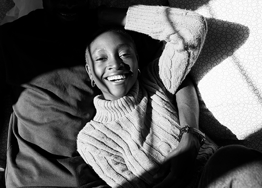 Woman laying down and laughing